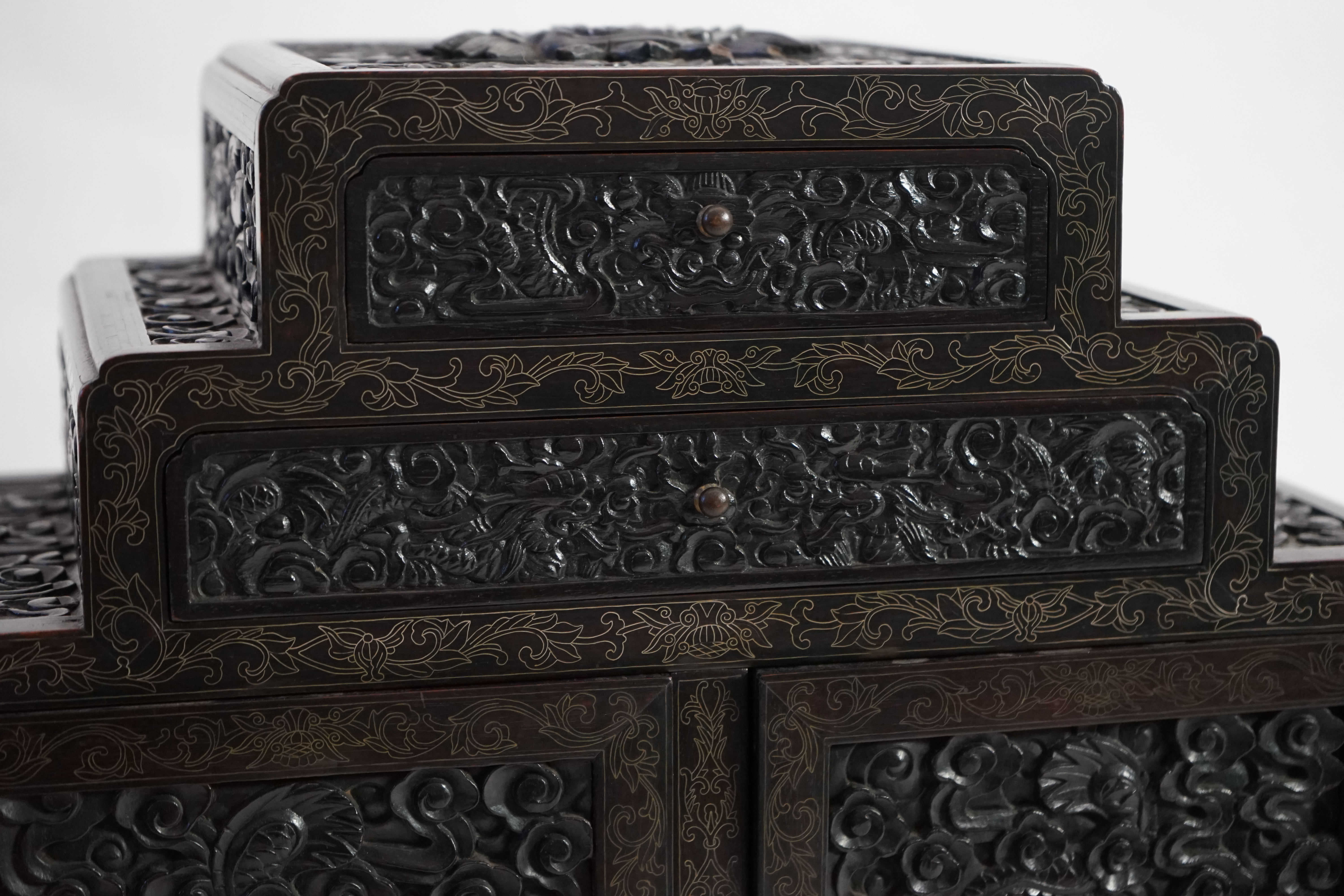 An important pair of Chinese carved zitan and silver wire inlaid ‘cloud and dragon’ curio cabinets and stands, duobaoge, probably Imperial, late Qing dynasty